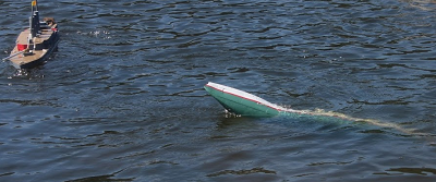 model warship sinking from heavy damage